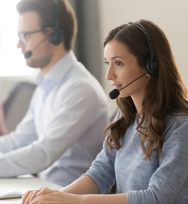 Woman man and computer for call center